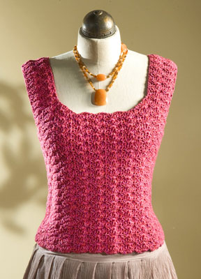 A pink tank top on a mannequin.