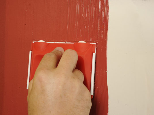 Apply touch up paint to the patch in your wall color.